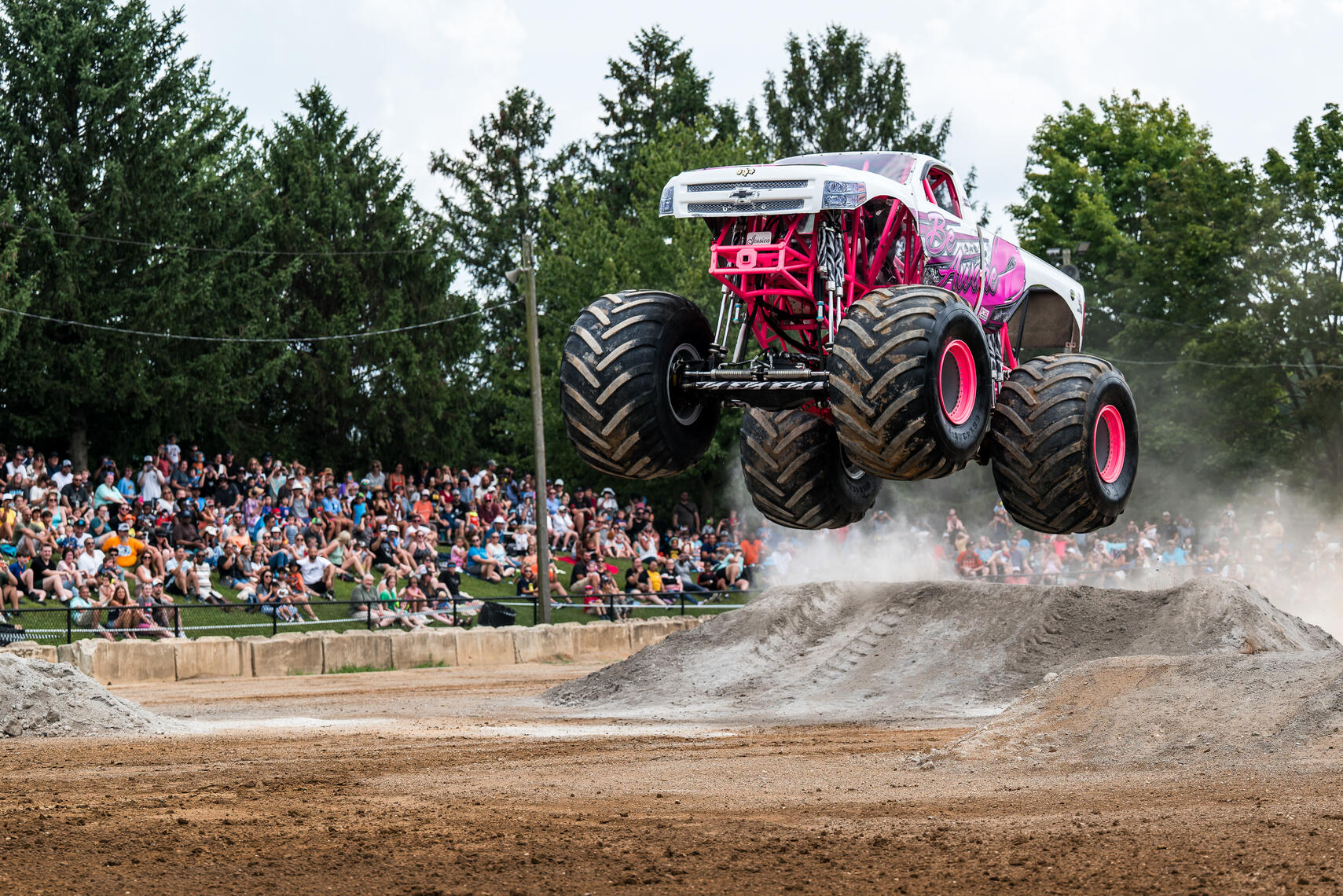 WESTMINSTER, MD - The monster truck "Be Aware" soars over a dirt ramp during the July 11, 2026 monster truck event at the Carroll County AG Center in Westminster, Maryland.